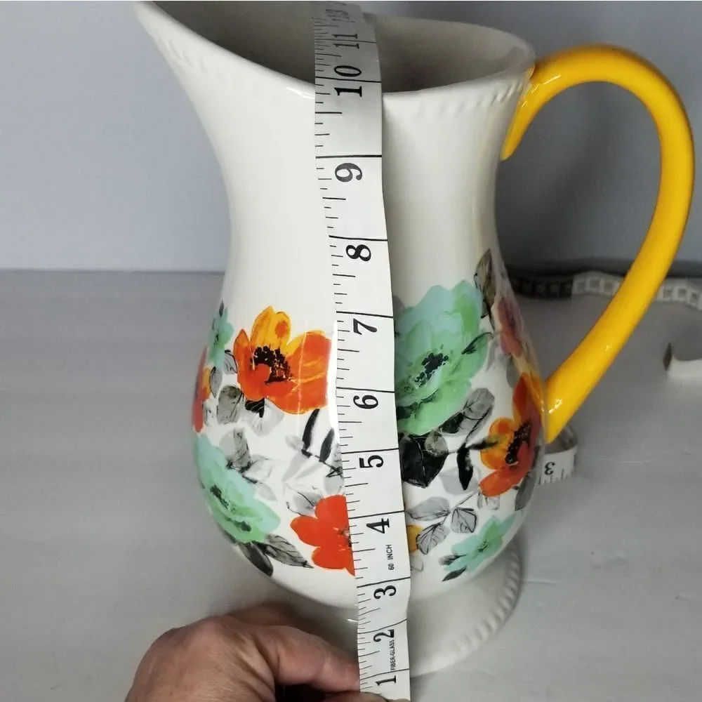 Pioneer Woman pitcher floral white base yellow handle